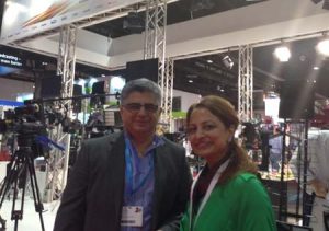 Kaveh Farnam, CEO of Advanced Media Trading at CABSAT along with a team member. 