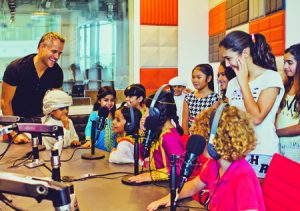 Nick Watson with kids in the Pearl FM studio.