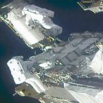 Spacewalking astronauts prepare station for new solar wings